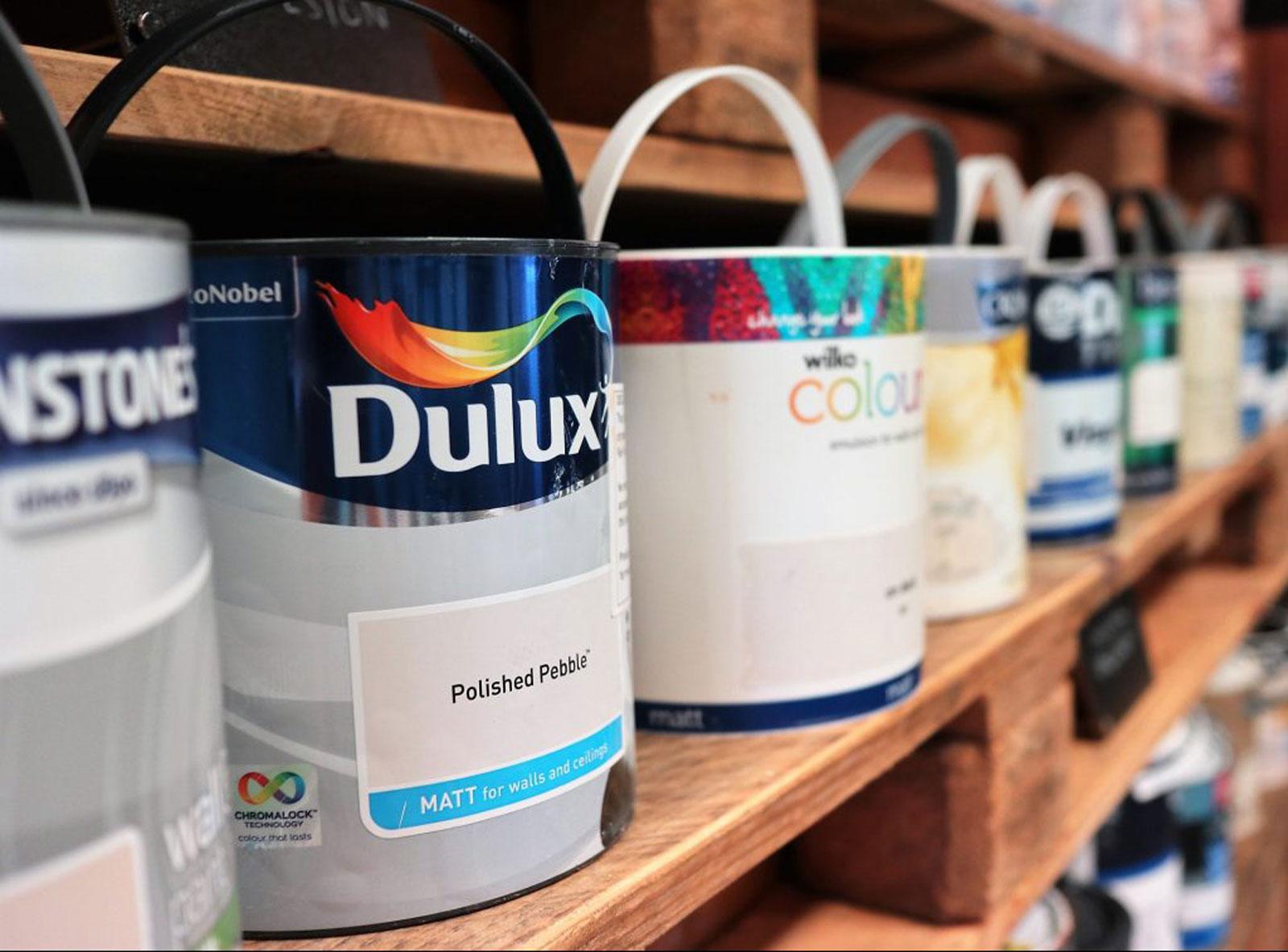 Dulux paint cans on a shelf