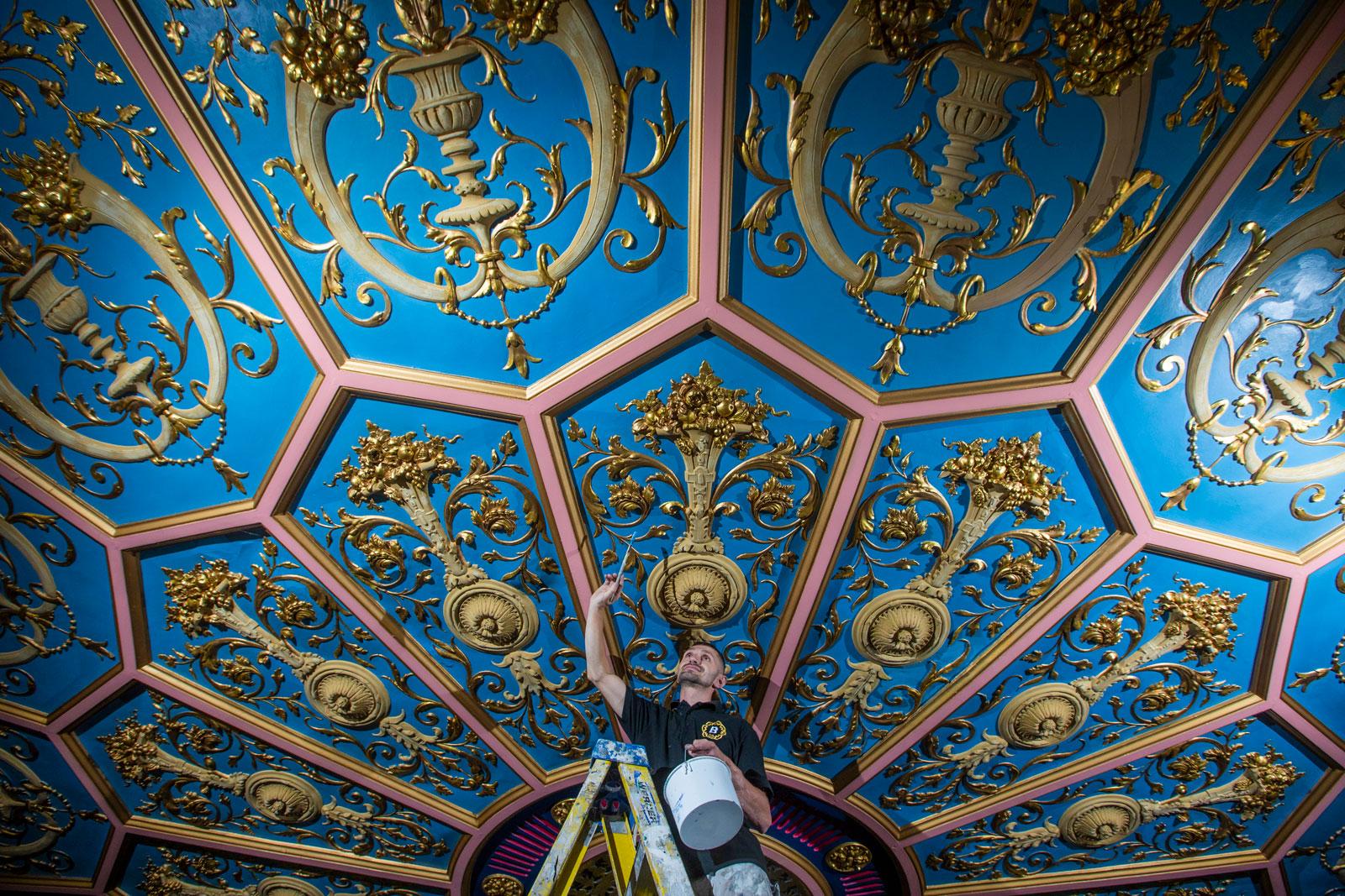 Borthwick foreman Kamil Fus painting the ceiling of the Royal Lyceum Theatre