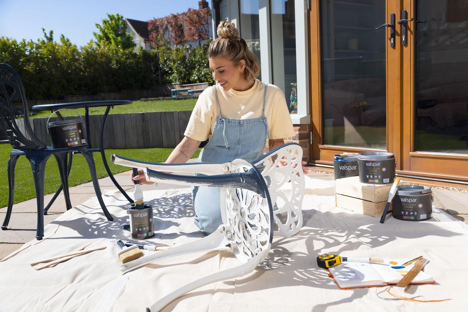 Photograph of Olivia Bowen using paint from her new Valspar range.