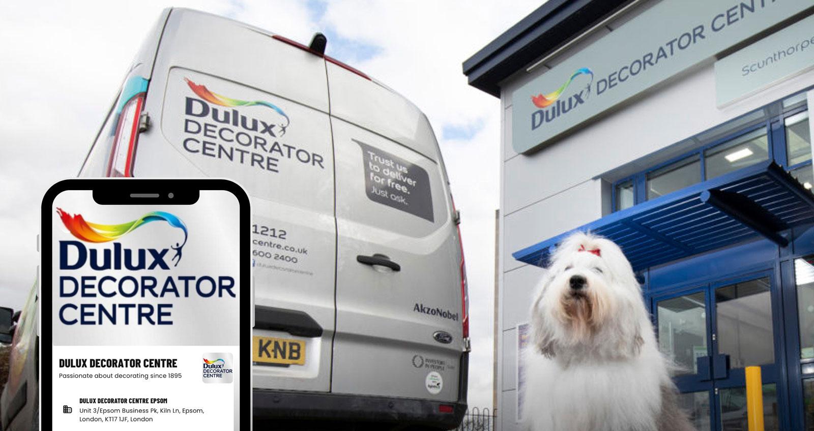 Photograph of the exterior of a Dulux Decorator Centre with Dulux dog standing outside.